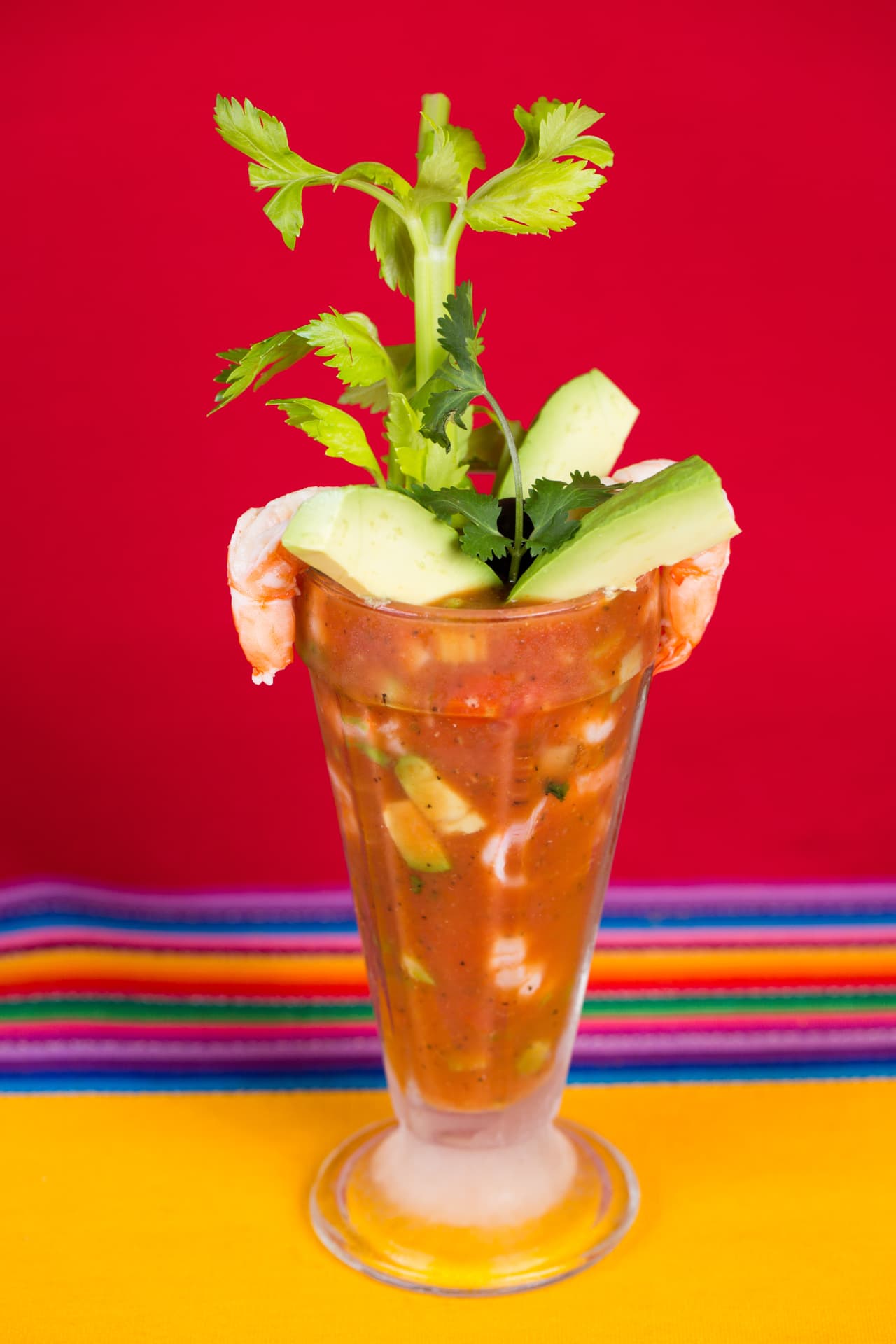 Mexican shrimp cocktail topped with avocado, celery, and fresh cilantro
